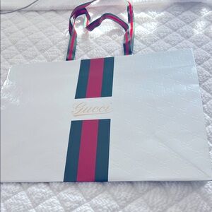 Gucci white embossed vintage shopping bag.